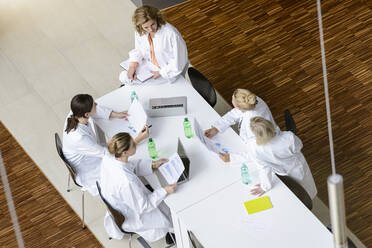 Female doctors having a meeting in conference room - BMOF00367