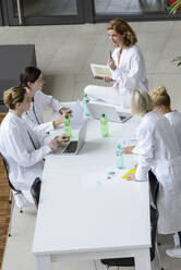 Female doctors having a meeting in conference room - BMOF00370