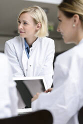 Female doctors having a meeting in conference room - BMOF00378