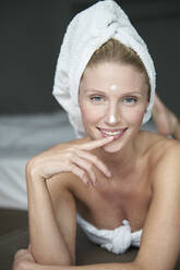 Portrait of beautiful woman with head wrapped in a towel - PNEF02563