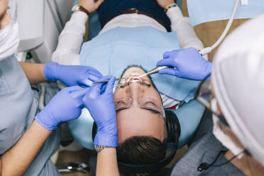 Man receiving dental treatment - DGOF00610