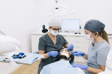 Man receiving dental treatment - DGOF00615