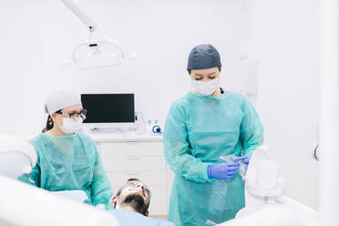 Man receiving dental treatment - DGOF00625