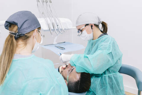 Man receiving dental treatment stock photo