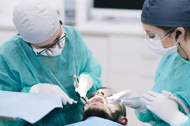 Man receiving dental treatment - DGOF00632