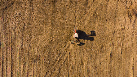 Aerial view of tractor in the field near Bjelopolje in Lika, Croatia. - AAEF07287