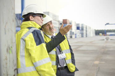 Dock manager and worker talking at shipyard - CAIF25090