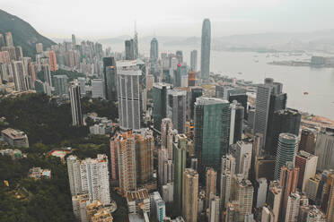 Aerial view of Hong Kong's iconic skyline with colourful apartments near the ocean, Hong Kong island. - AAEF07735