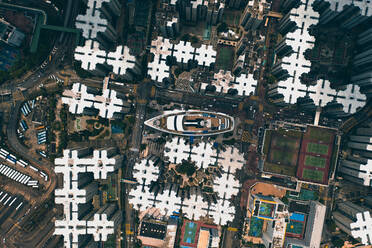 Aerial view of boat between buildings in Whampoa Gardens, Hong Kong. - AAEF07739