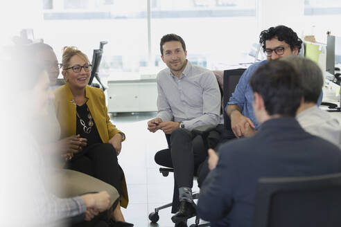 Business people meeting in a circle in office - CAIF25345