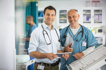 Portrait confident male doctors in hospital - CAIF25466