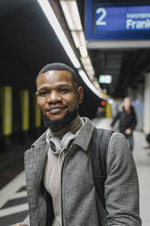 Portrait of stylish man in a metro station - AHSF02122