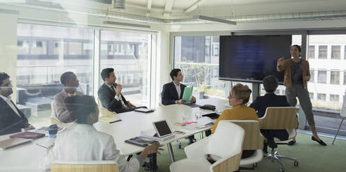 Businesswoman leading conference room meeting - CAIF25548