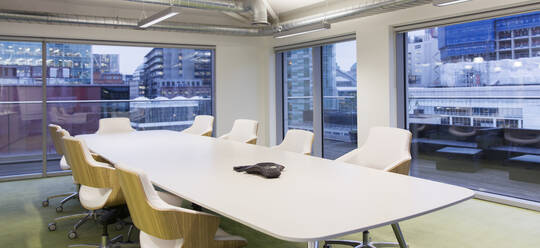 Conference table in modern, urban conference room - CAIF25561