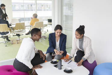 Businesswomen in conference room meeting - CAIF25583