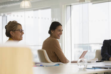 Happy businesswoman in conference room meeting - CAIF25636