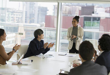 Businesswoman leading conference room meeting - CAIF25654