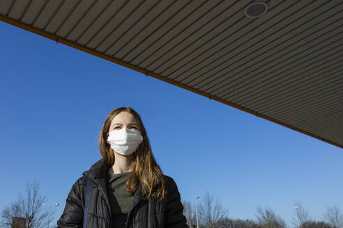 Portrait of girl wearing mask outdoors - OJF00378