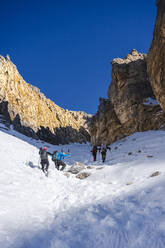 Group of mountaineers climbing a gully, Orobie Alps, Lecco, Italy - MCVF00267