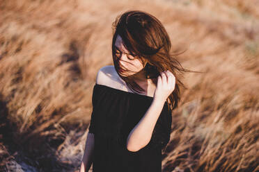 Close-Up Of Woman Standing In Grass - EYF02301