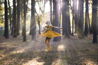 Girl Dancing Against Trees In Forest - EYF02591
