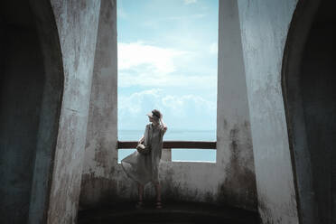 Full Length Of Fashionable Woman Standing In Abandoned Building - EYF02676