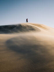 Man Walking On Desert Against Sky - EYF02882