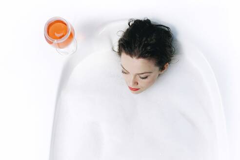 High Angle View Of Young Woman Taking Milk Bath - EYF03162