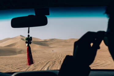 Cropped Image Of Man In Car At Desert - EYF03204
