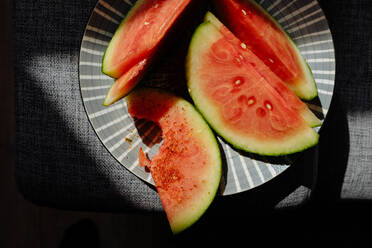 High Angle View Of Melon In Plate On Table - EYF03246