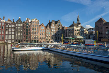 The Netherlands, North Holland Province, Amsterdam, Damrak, Tourboats and port buildings - LBF03033