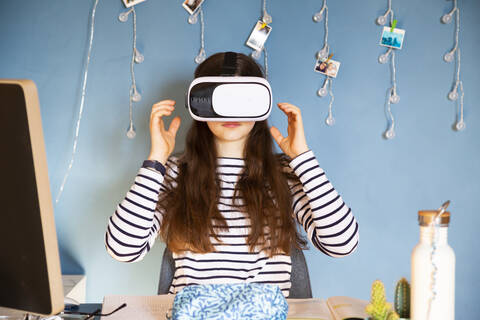 Portrait of girl at home using Virtual Reality Glasses stock photo