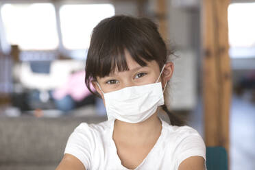 Girl wearing mask at home - DRF01756