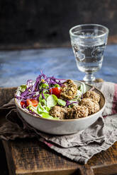 Bowl of ready-to-eat salad with spinach falafel - SBDF04242