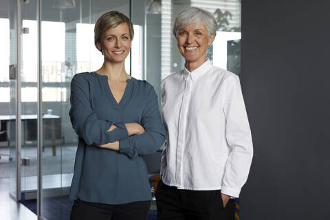 Portrait of two confident businesswomen in office stock photo