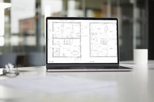 Tablet with floor plan in office - RBF07432