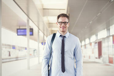 Portrait confident businessman in train station - CAIF25774