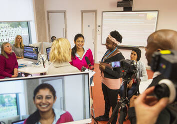 Community college students filming in media classroom - CAIF25813