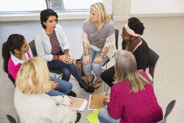 Women's support group talking in circle - CAIF25851