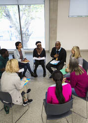 People talking in support group meeting circle - CAIF25933