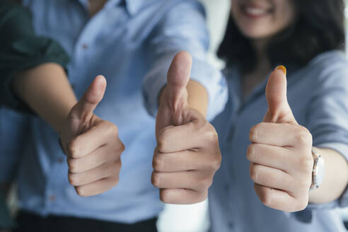 Closeup gruop of business people giving thumbs up - CAVF78257