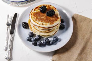 Stack of homemade pancakes on a plate - CAVF78554