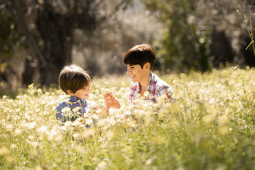 Mother and daughter in a field of wildflowers - VSMF00071