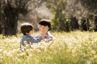 Mother and daughter in a field of wildflowers - VSMF00093