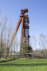 Germany, North Rhine-Westphalia, Kamen, Low angle view of abandoned shaft tower standing against clear sky - WIF04229