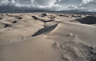 Golden sand dunes on rare rainy day in the deserts of utah stock photo