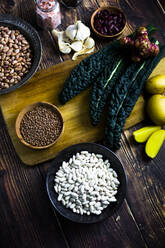 Black cabbage, potatoes and bowls of various beans and lentils - GIOF08100