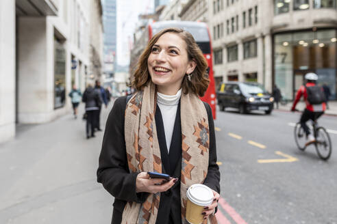 Portrait of happy woman in the city, London, UK - WPEF02762