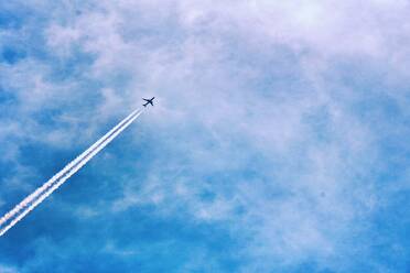 Low Angle View Of Vapor Trail Against Blue Sky - EYF03857