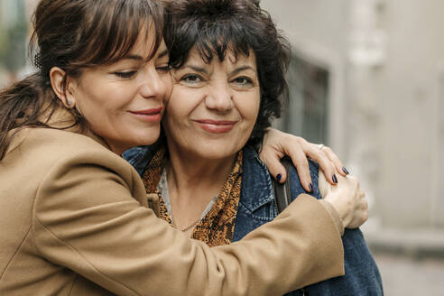 Portrait of happy woman hugging her mother - OGF00278